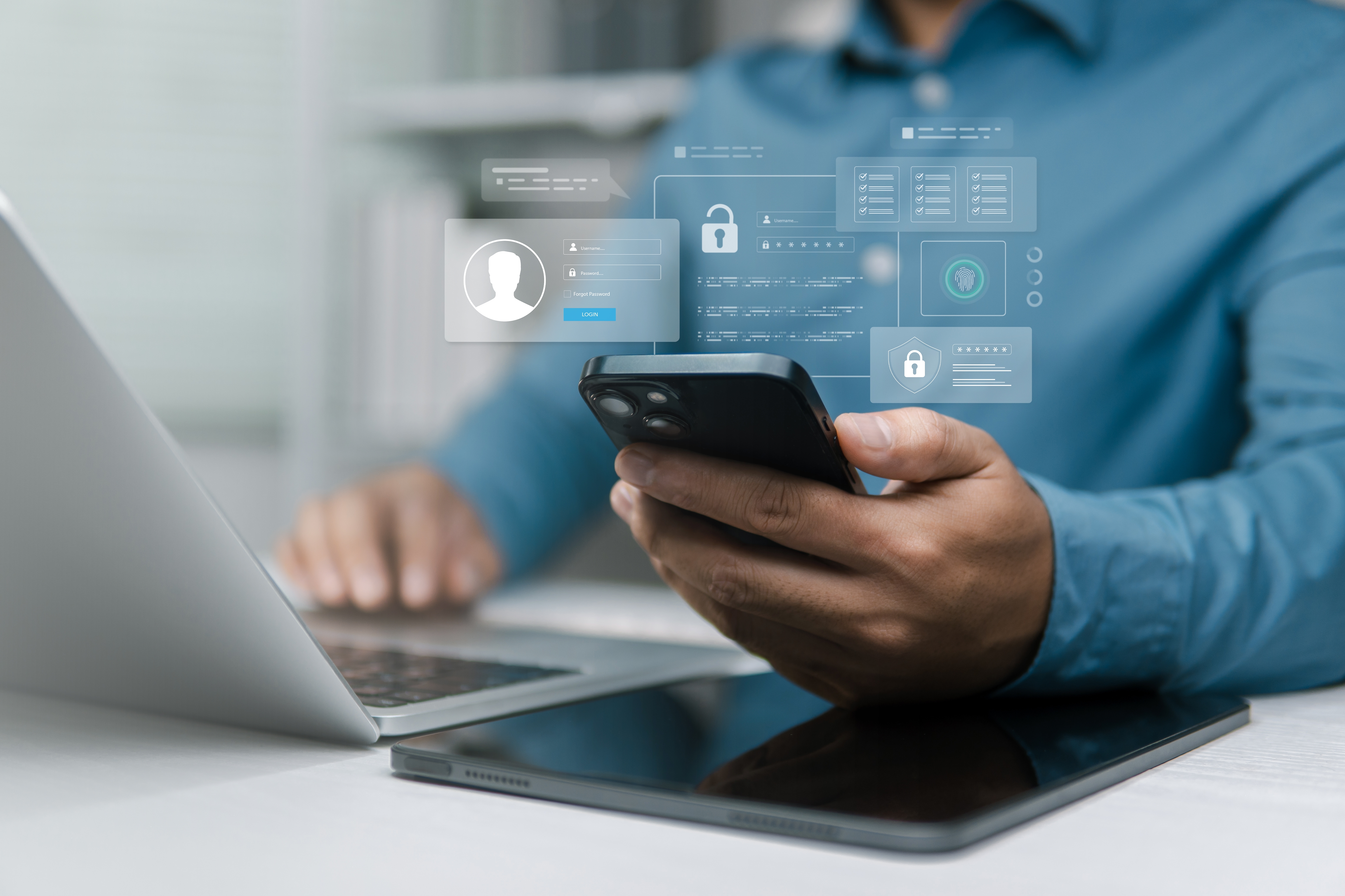 A man at a laptop and holding a smartphone with graphics showing privacy and data encryption for protecting privacy online.
